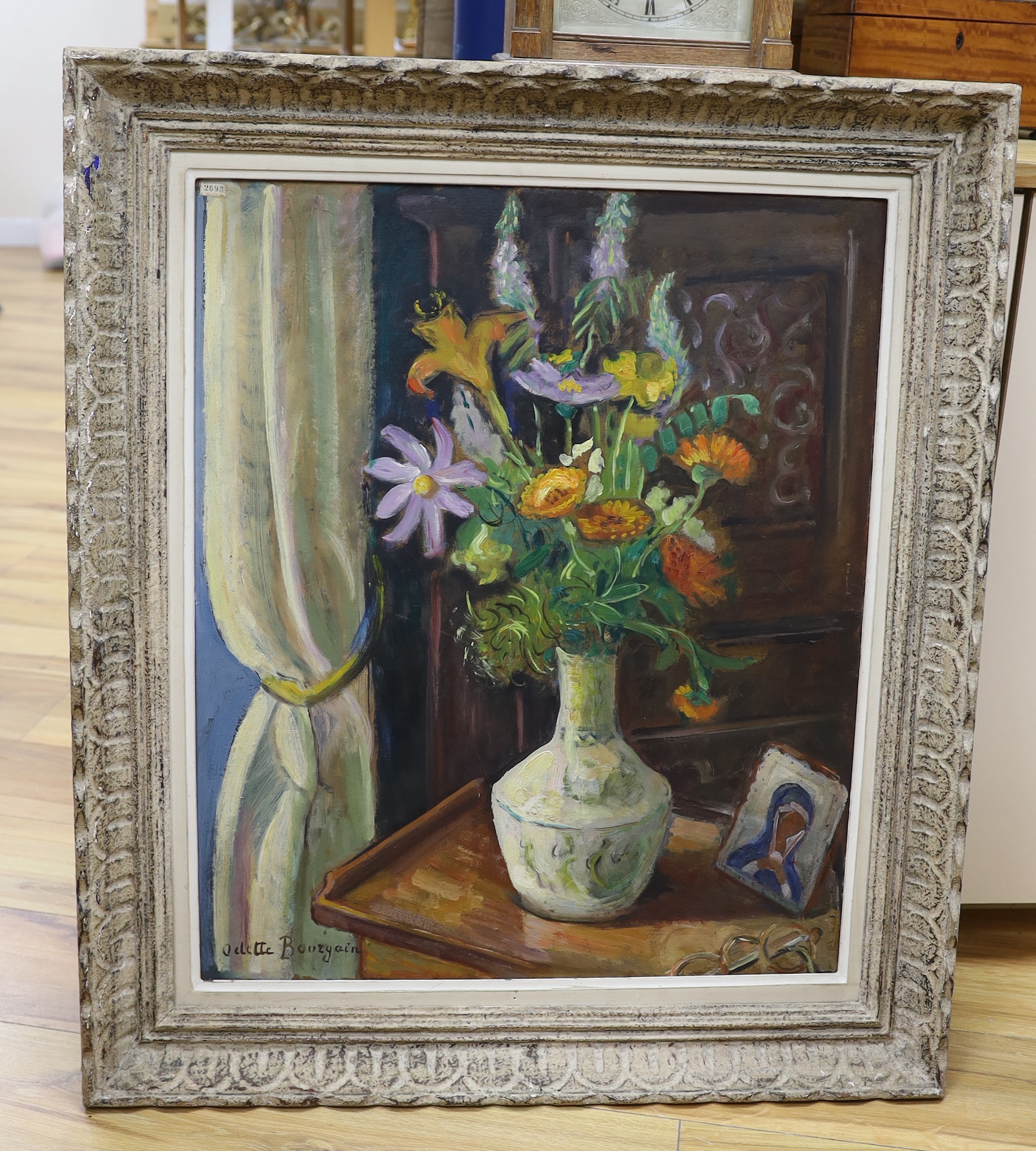 Odette Bourgain (French, 19/20th. C), oil on board, still life of flowers in a vase, signed, inscribed verso, 64 x 53cm